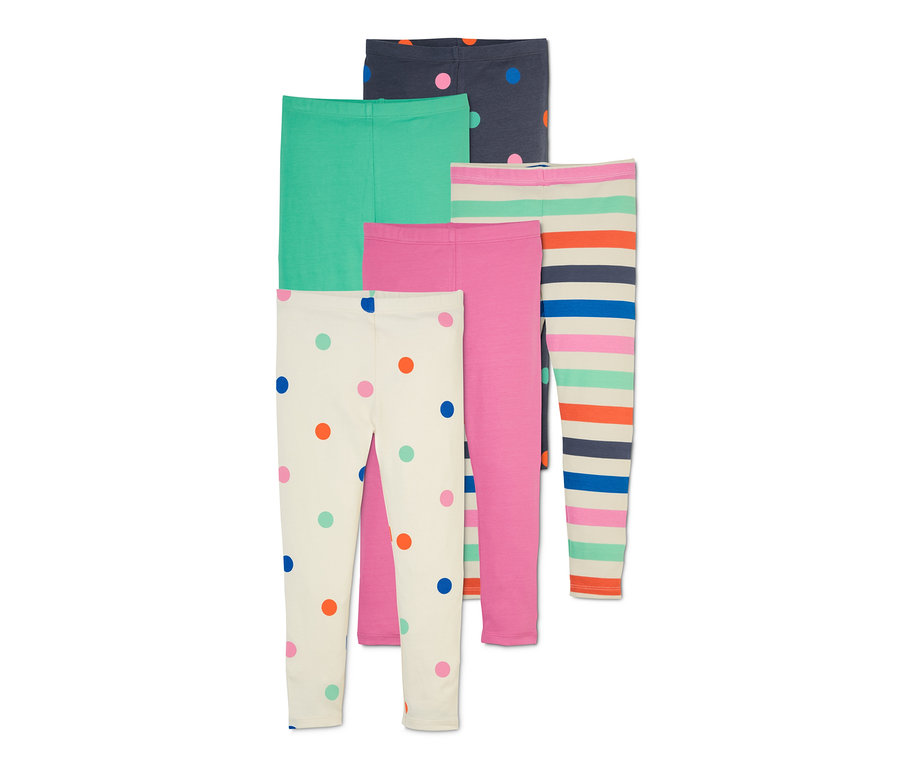 Fünf Leggings: eine hellbeige mit bunten Punkten, eine grüne, eine pinke, eine mit bunten Streifen und eine dunkelblaue mit bunten Punkten.