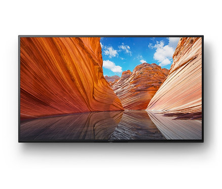 Ein schwarzer Sony KDX80JAEP Fernseher zeigt eine Sandlandschaft.