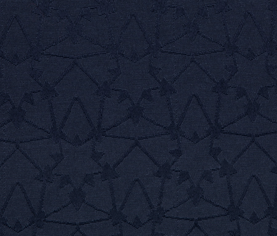 Detailaufnahme einer dunkelblauen Jacquard-Tischdecke mit geometrischem Muster.