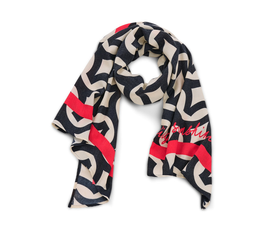 Detailansicht eines bedruckten Webschals in Creme, Dunkelblau und Rot.