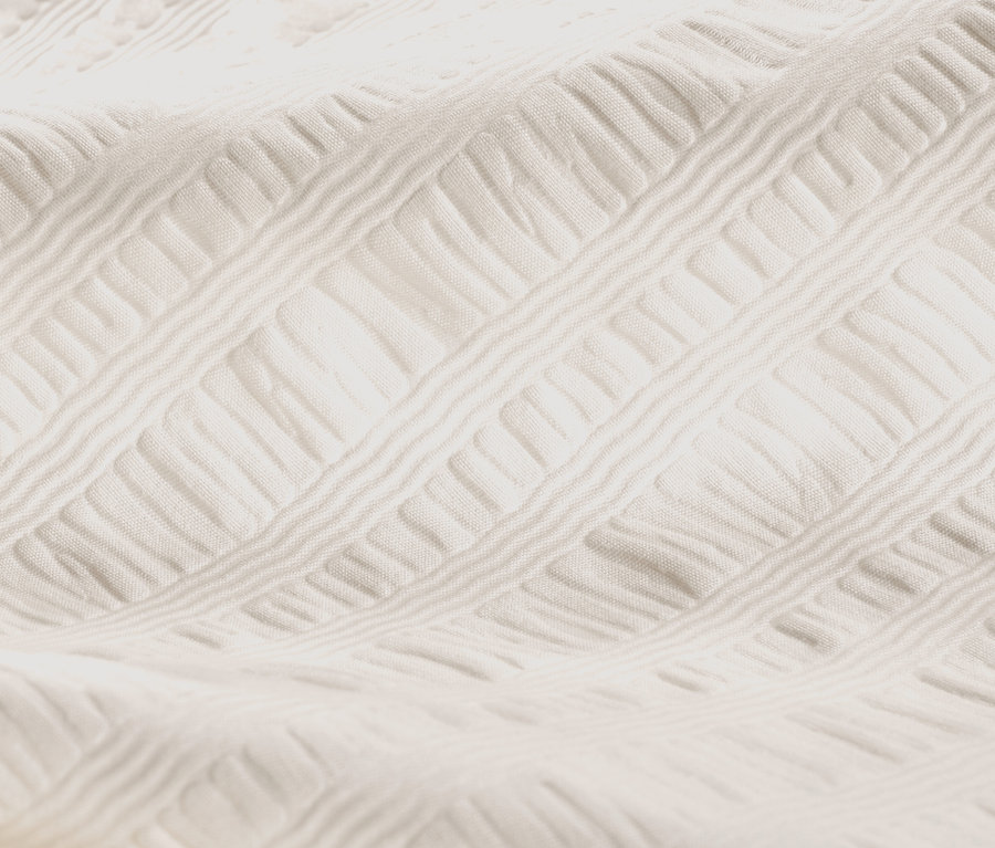 Nahaufnahme von offweißer Seersucker-Bettwäsche in Normalgröße und Übergröße.