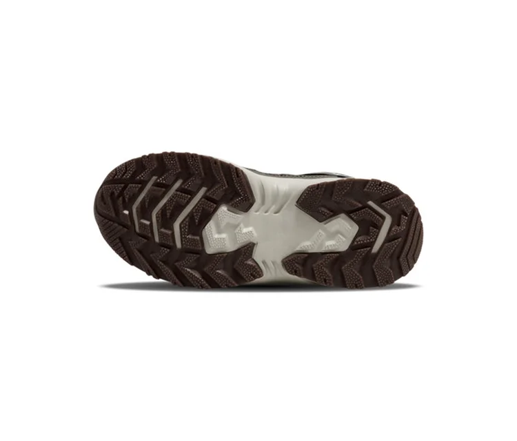 Unterseite der Sohle eines hummel® Root Tex Jr Turnschuhs mit dunkelbraunem und beigem Profil.