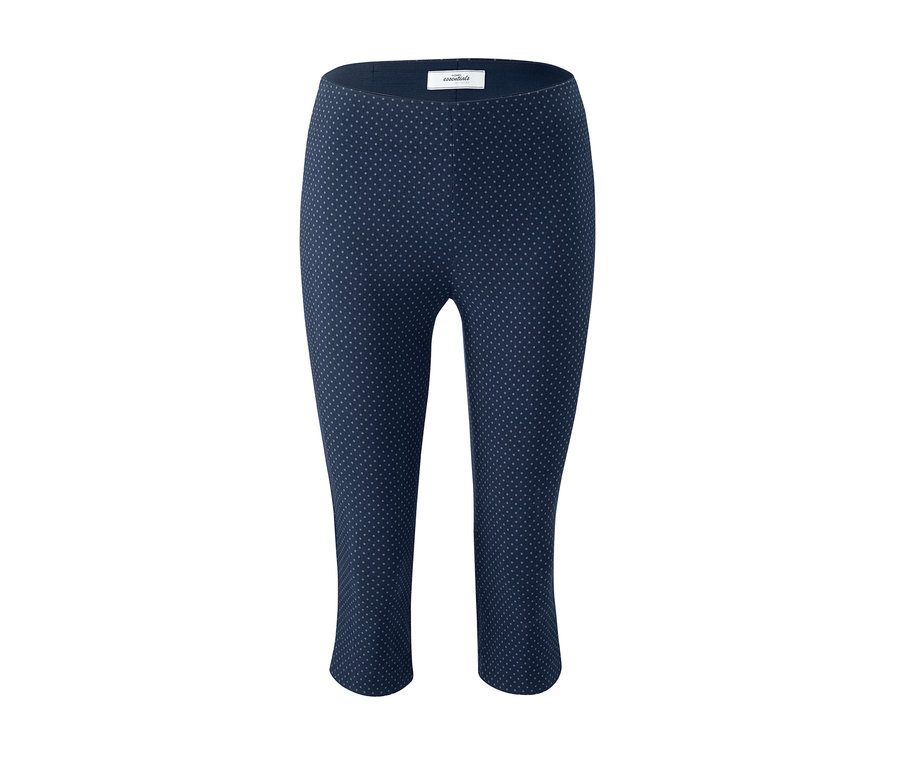 Eine marineblaue Stretchhose in 3/4-Länge mit Punkten.