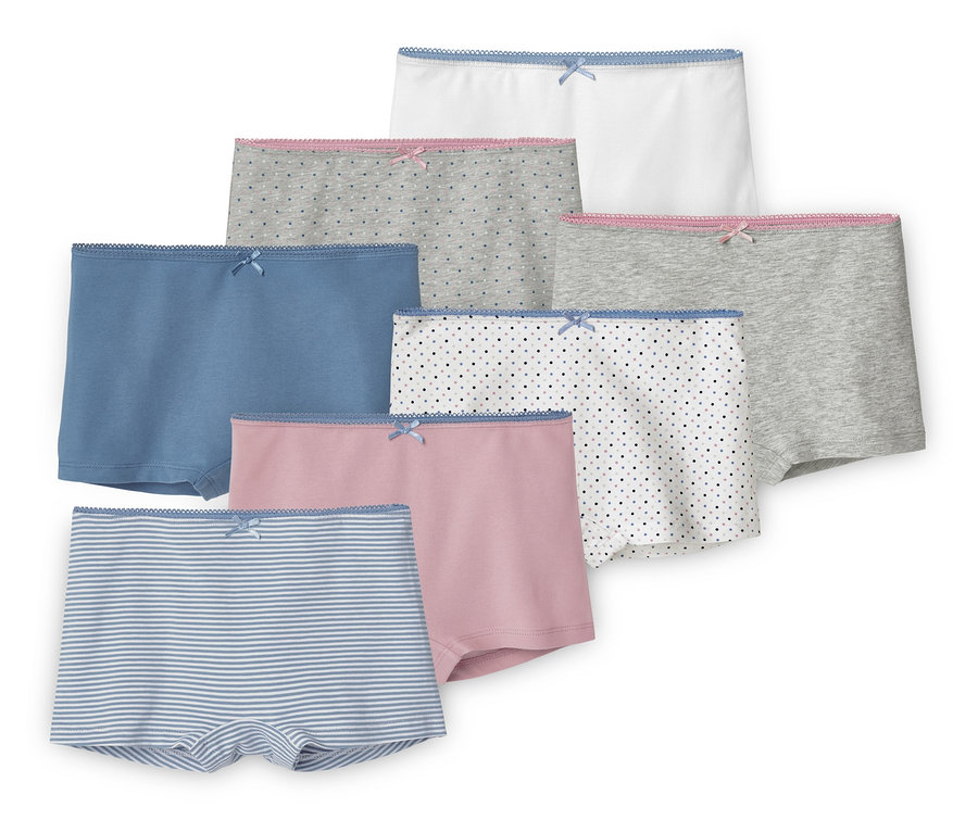 Sieben Mädchen-Pantys in verschiedenen Farben und Mustern.