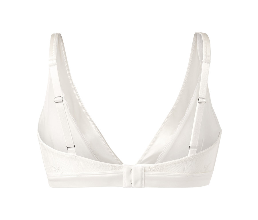Detailansicht eines cremeweißen Soft-BHs mit verstellbaren Trägern und Hakenverschluss.