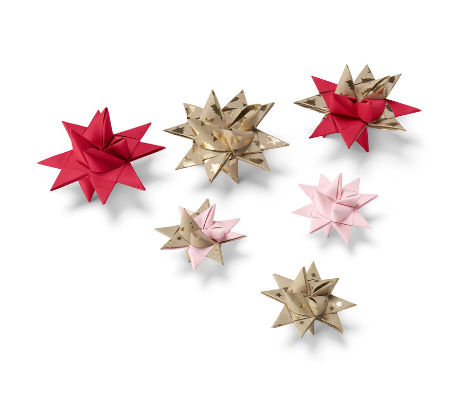 Sieben Papiersterne in verschiedenen Farben aus dem Papiersterne-Bastel-Set.
