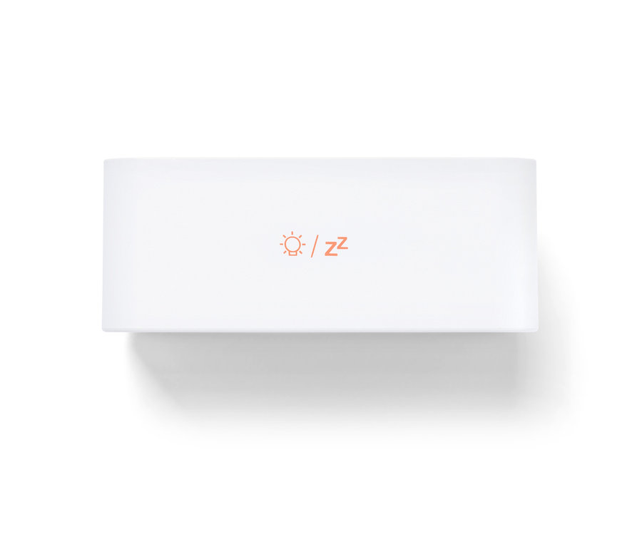 Ein weisser digitaler LCD-Wecker mit einem Sonnen-Symbol und Z-Buchstaben in Orange.