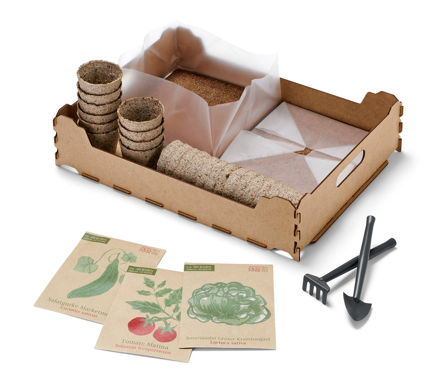 Indoor-Anzucht-Starter-Set mit Töpfen, Samen und Gartengeräten.