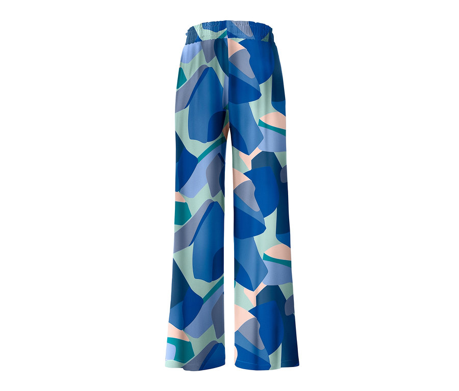 Eine Relaxhose mit blauem und grünem geometrischem Muster.