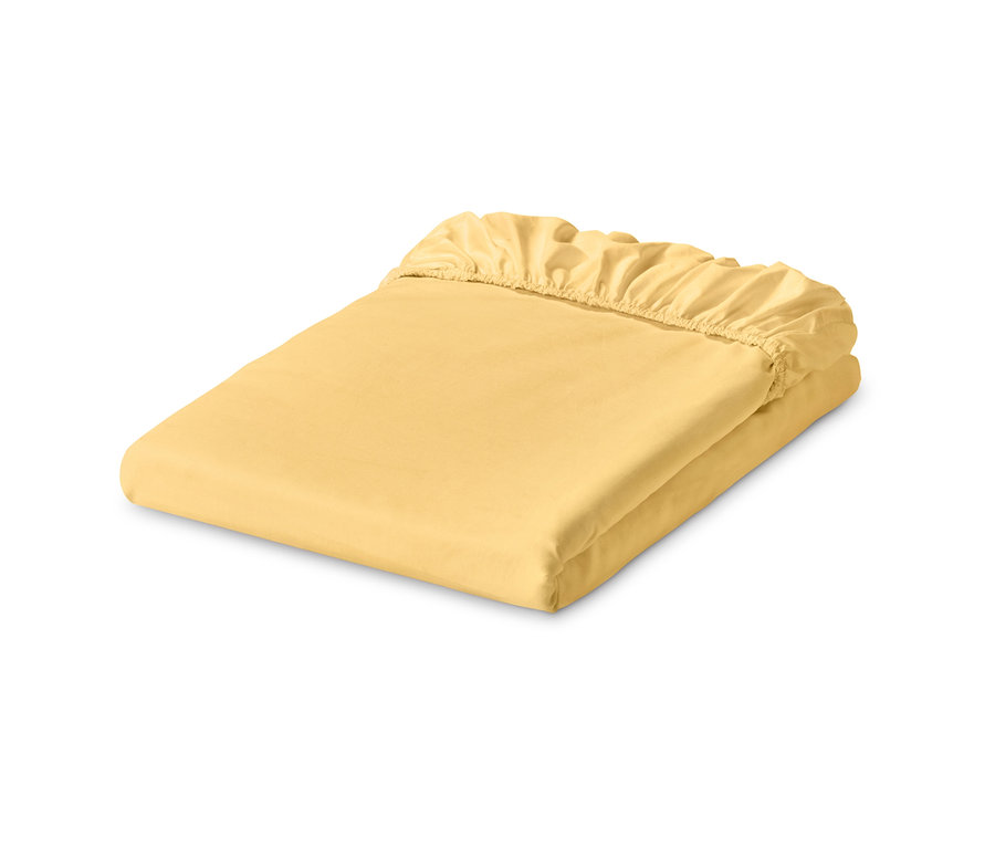 Ein gelbes Jersey-Spannbettlaken, gefaltet.