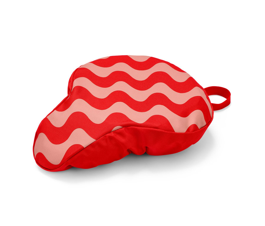 Rot-rosa Fahrradsattelbezug mit Wellenmuster.