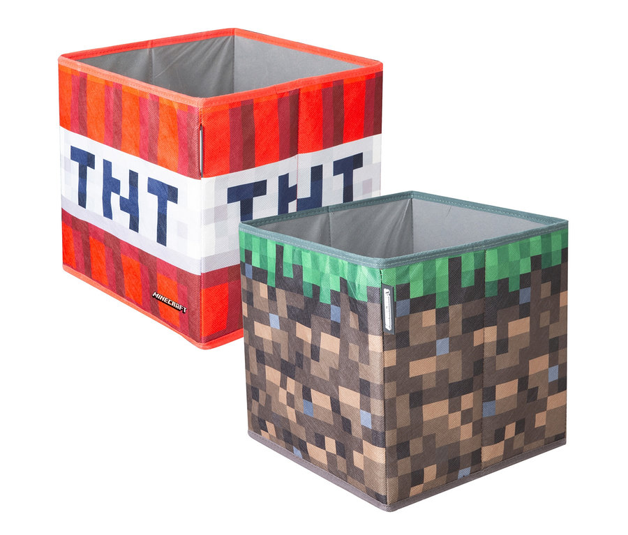 Zwei Minecraft Aufbewahrungsboxen in Würfelform: eine mit TNT- und eine mit Grasblock-Motiv.