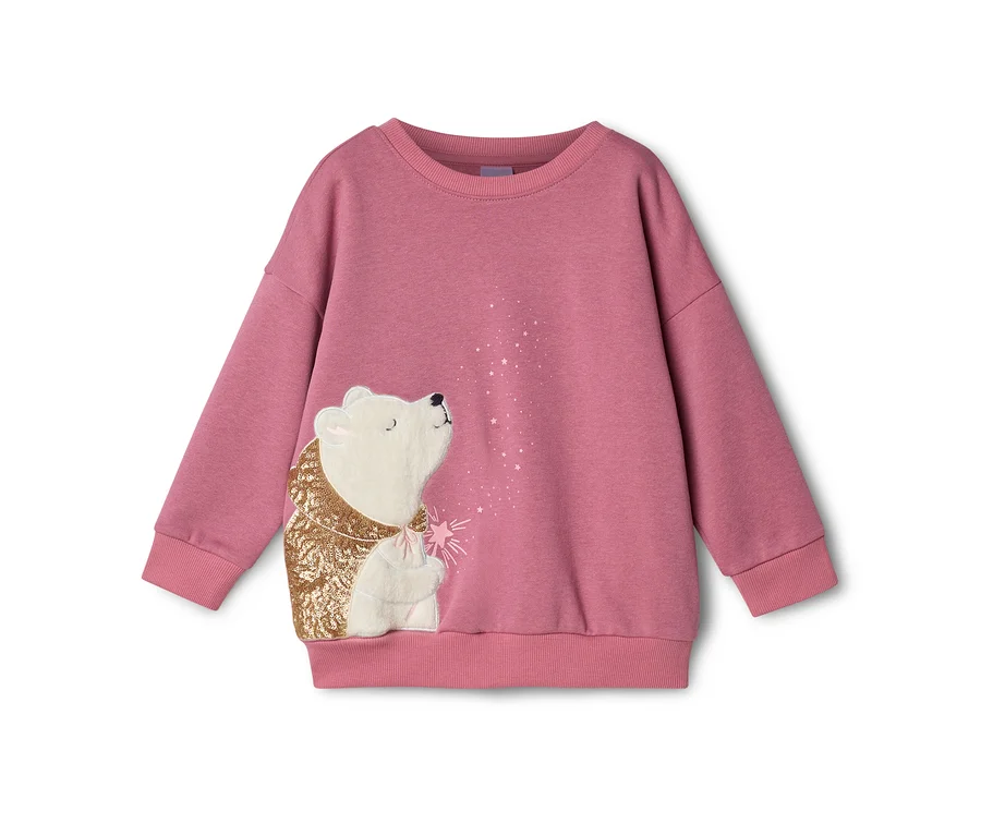 Rosa Sweatshirt mit einem weißen Eisbären in goldener Paillettenjacke, der zu rosa und weißen Sternen aufblickt.