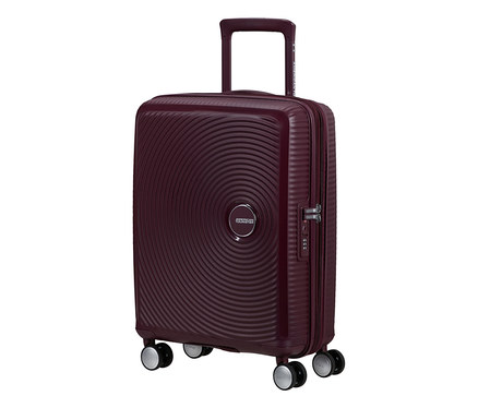 American Tourister Hartschalen-Koffer Soundbox Spinner in Wildkirschrot mit konzentrischen Kreisen und ausziehbarem Griff.
