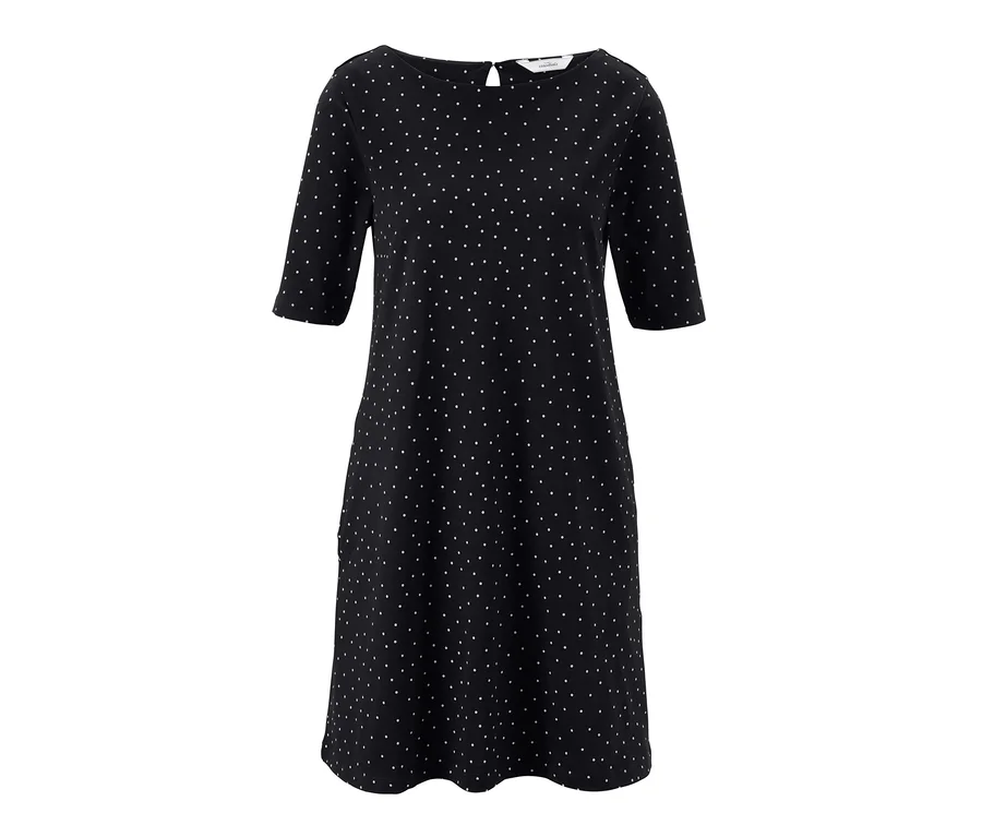 Schwarzes Jerseykleid im Punkte-Dessin.
