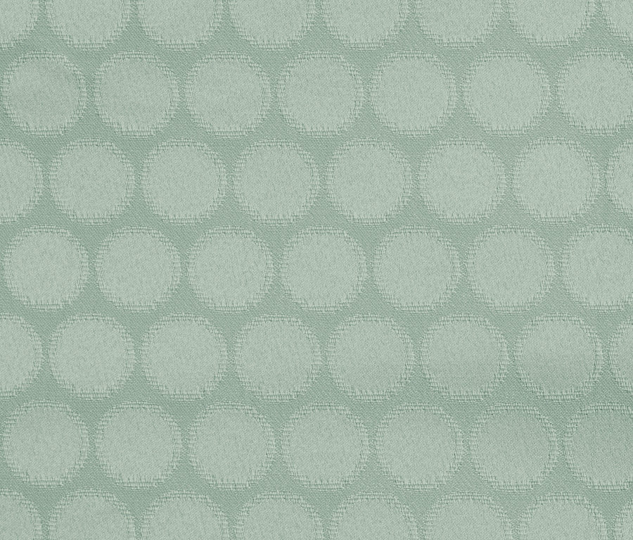 Nahaufnahme einer Jacquard-Tischdecke mit Punktmuster.