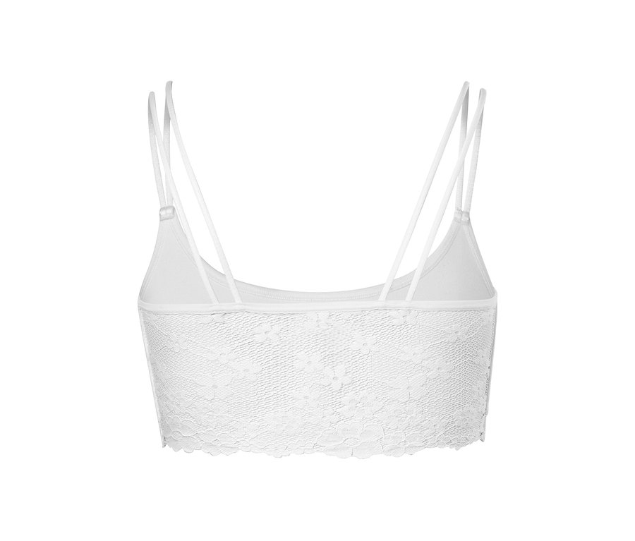 Detailansicht eines weißen Seamless-Bustiers mit Spitze und dünnen Trägern.