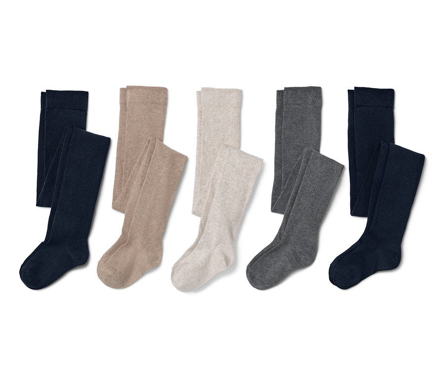 Fünf Paar Strumpfhosen in verschiedenen Farben.