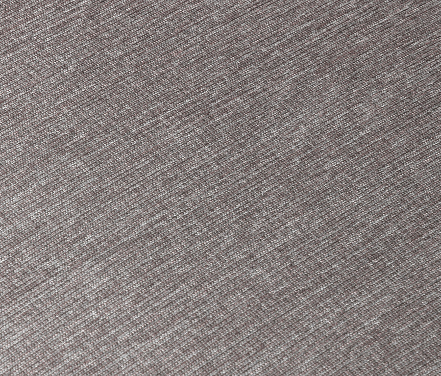 Detailaufnahme von einem grauen Sessel mit Drehfunktion.