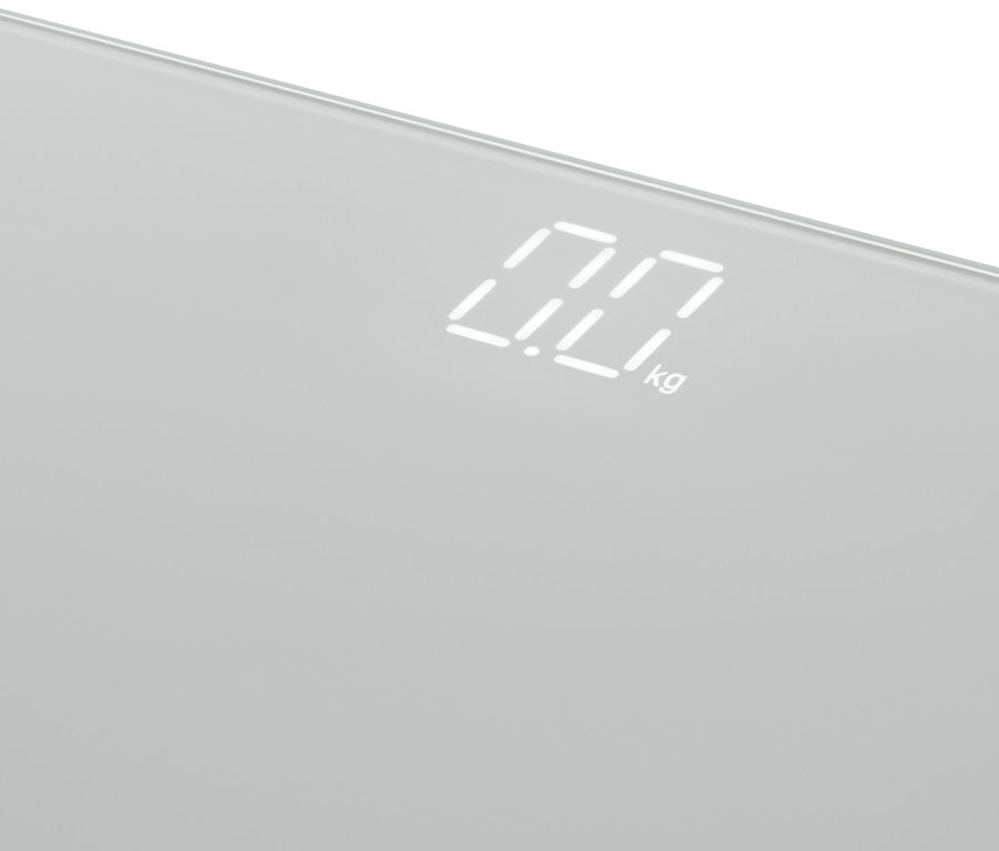 Detailansicht einer ultrakompakten Badwaage mit Digitalanzeige, die 0,0 kg anzeigt.
