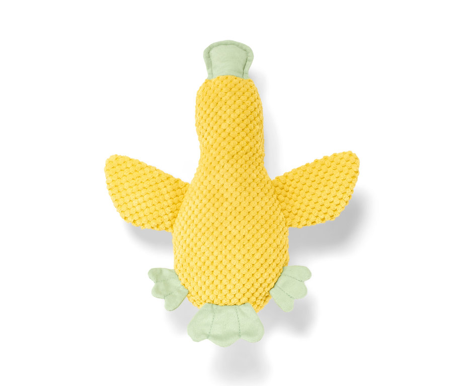 Gelbes Hunde-Plüschspielzeug »Ente« liegt auf einem weißen Hintergrund.