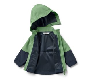 Geöffnete Kinder-Softshelljacke in Grün und Dunkelblau.
