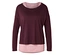 Dunkelrotes, langärmliges Oberteil über einem rosa Tanktop.