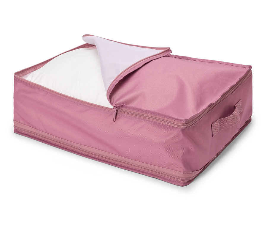 Ein rosa Aufbewahrungsbehälter mit Reißverschluss ist teilweise geöffnet und enthält ein weißes Kissen.