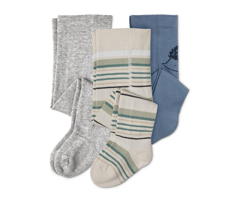Drei Strumpfhosen: grau, beige gestreift und blau mit Blattdruck.