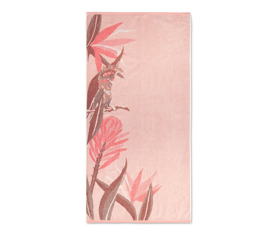 Aprikotfarbenes Veloursbadetuch im Tropic-Design.