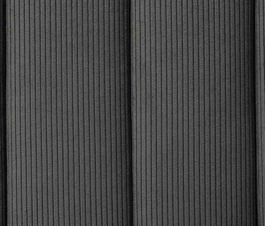 Detailansicht eines anthrazitfarbenen Boxspringbettes mit regelmäßiger, vertikaler Steppung.