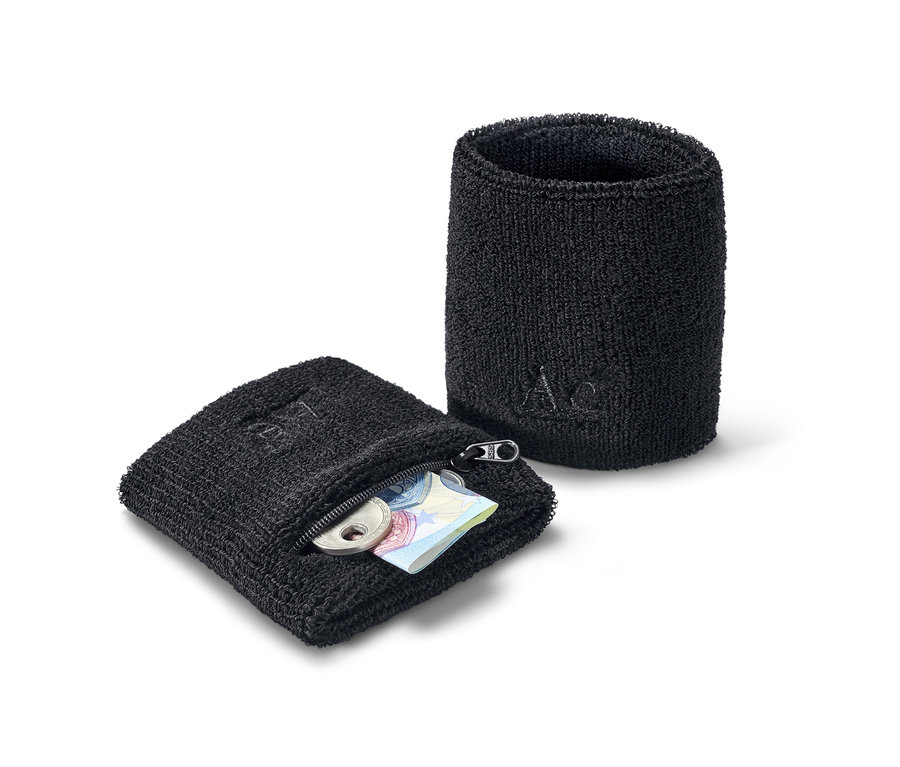 Zwei schwarze Schweißbänder, eines mit Reißverschluss, mit Münzen und Banknoten im Inneren.