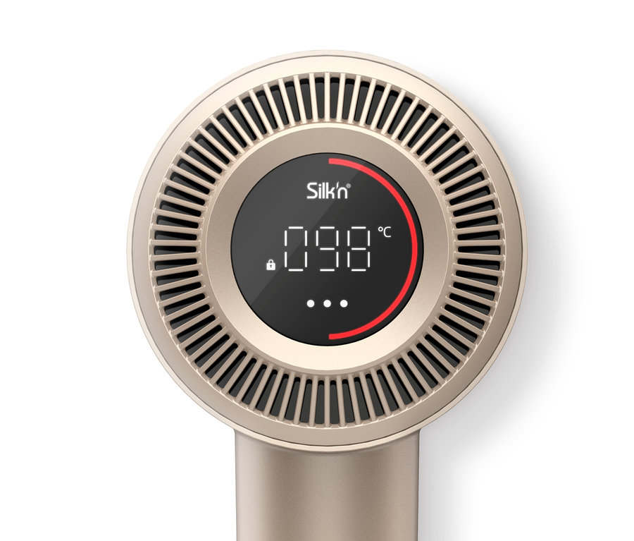 Detailaufnahme des goldenen Silk'n Haartrockners »SilkyAir Pro« mit schwarzem Display, das die Temperatur anzeigt.