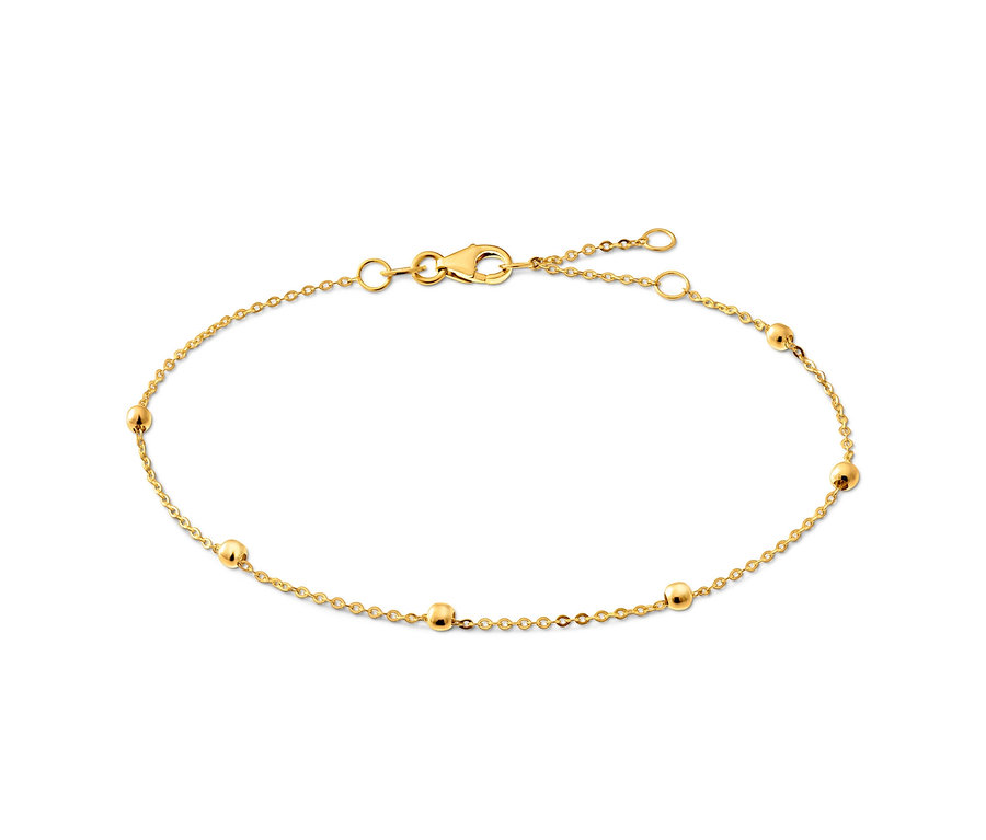 Goldenes Armband mit Kugeln auf weißem Hintergrund.