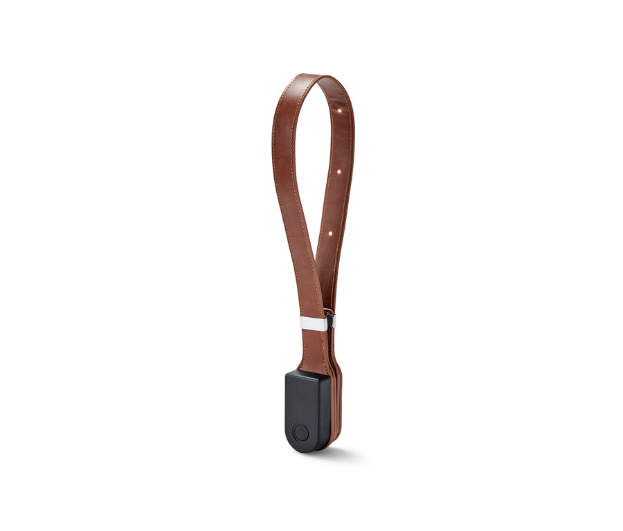 Leselampe mit magnetischem Clip-System mit braunem Lederband.