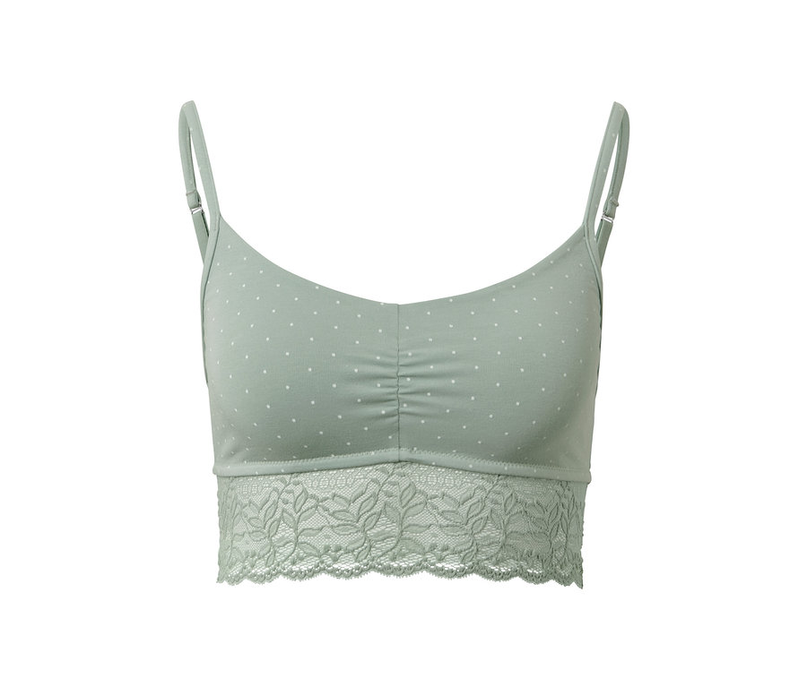 Grünes Bustier mit weißen Punkten und Spitzenrand.