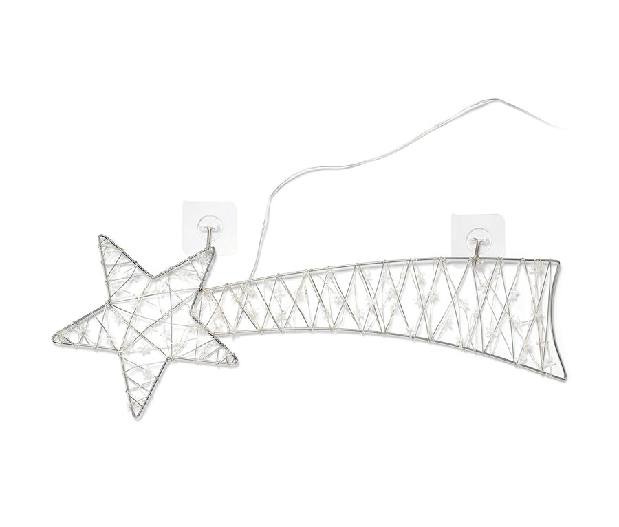Eine große LED-Sternschnuppe ist mit transparenten Halterungen an der Wand befestigt.
