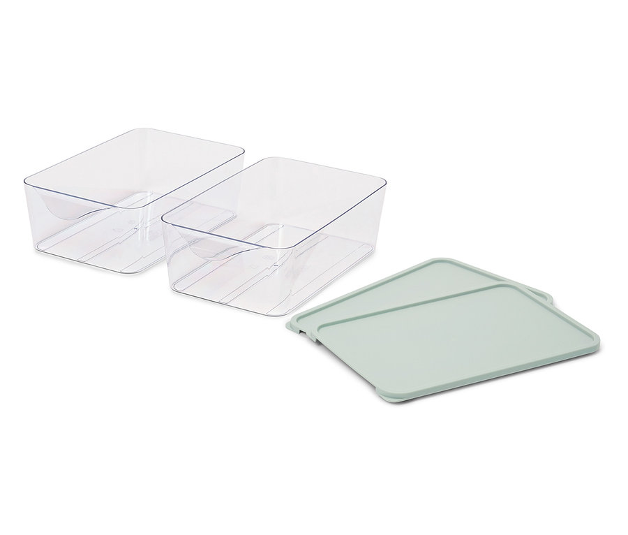 Zwei durchsichtige Plastikbehälter und ein grüner Deckel.