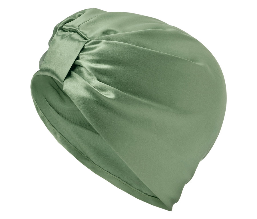 Nahaufnahme eines grünen Turban-Kopfbedeckung aus Seide.