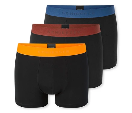 Drei schwarze Boxershorts, übereinanderliegend, mit blauen, rostbraunen und orangefarbenen Bundbändern mit SCHIESSER-Logo.