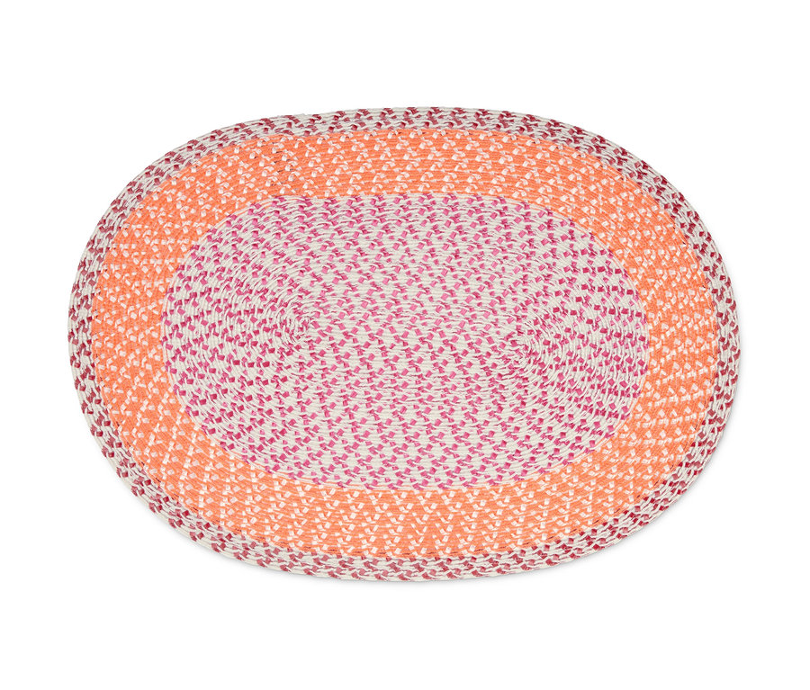 Detailaufnahme eines ovalen 4er-Platzsets mit orangefarbenem und rosa Muster.