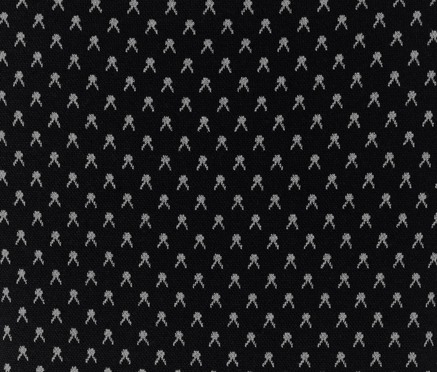 Detailaufnahme eines schwarzen Jacquard-Stoffs mit kleinem Muster.