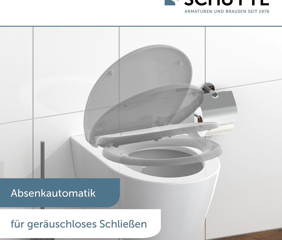 Weisse Toilette mit sich langsam schliessendem Deckel.
