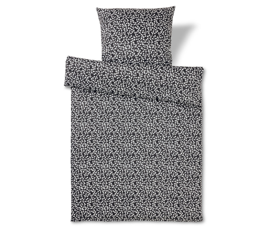 Schwarz-weißes Bettwäsche-Set mit Tupfenmuster.