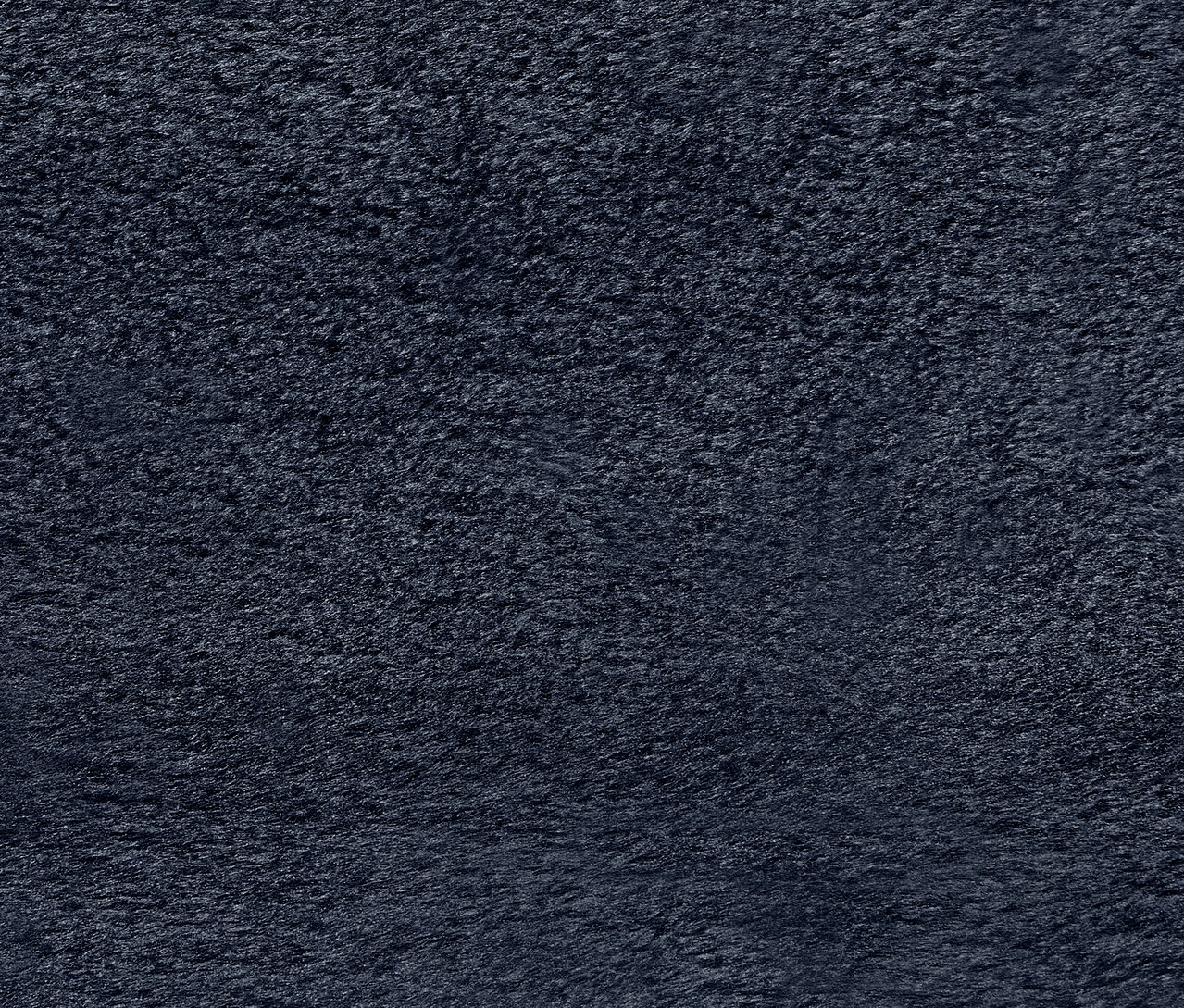 Nahaufnahme der Textur eines dunkelblauen Handtuchs.