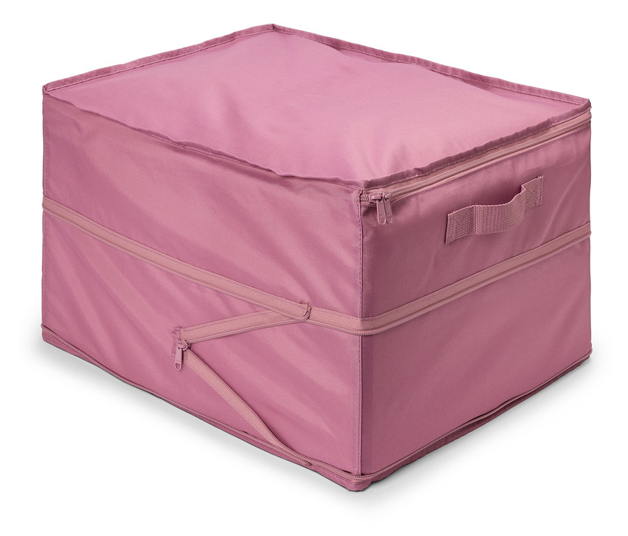 Ein rosa Stoffbehälter mit Reißverschluss und Griff liegt auf dem Boden.