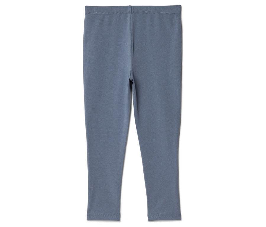 Blaue Leggings liegen auf einem weißen Hintergrund.