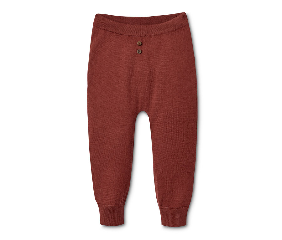 Baby-Strickhose aus 100% RWS-zertifizierter Merinowolle in rot mit zwei Knöpfen.