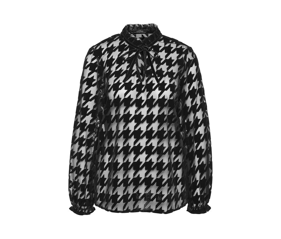 Eine schwarz-weiße Mesh-Bluse mit Hahnentrittmuster, langen Ärmeln und einem Bindeband am Hals.