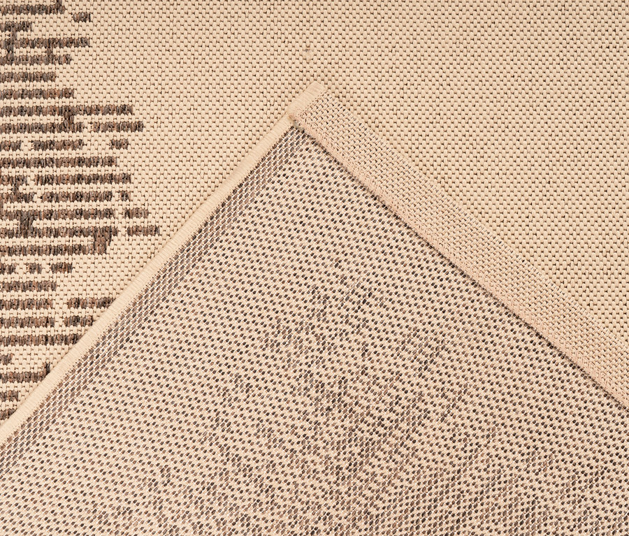 Detailansicht eines cremefarbenen Kayoom Outdoor-Teppichs »Splash 900« mit abstraktem braunem Muster.